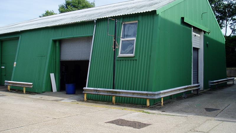 Unit exterior showing the main roller-shutter door